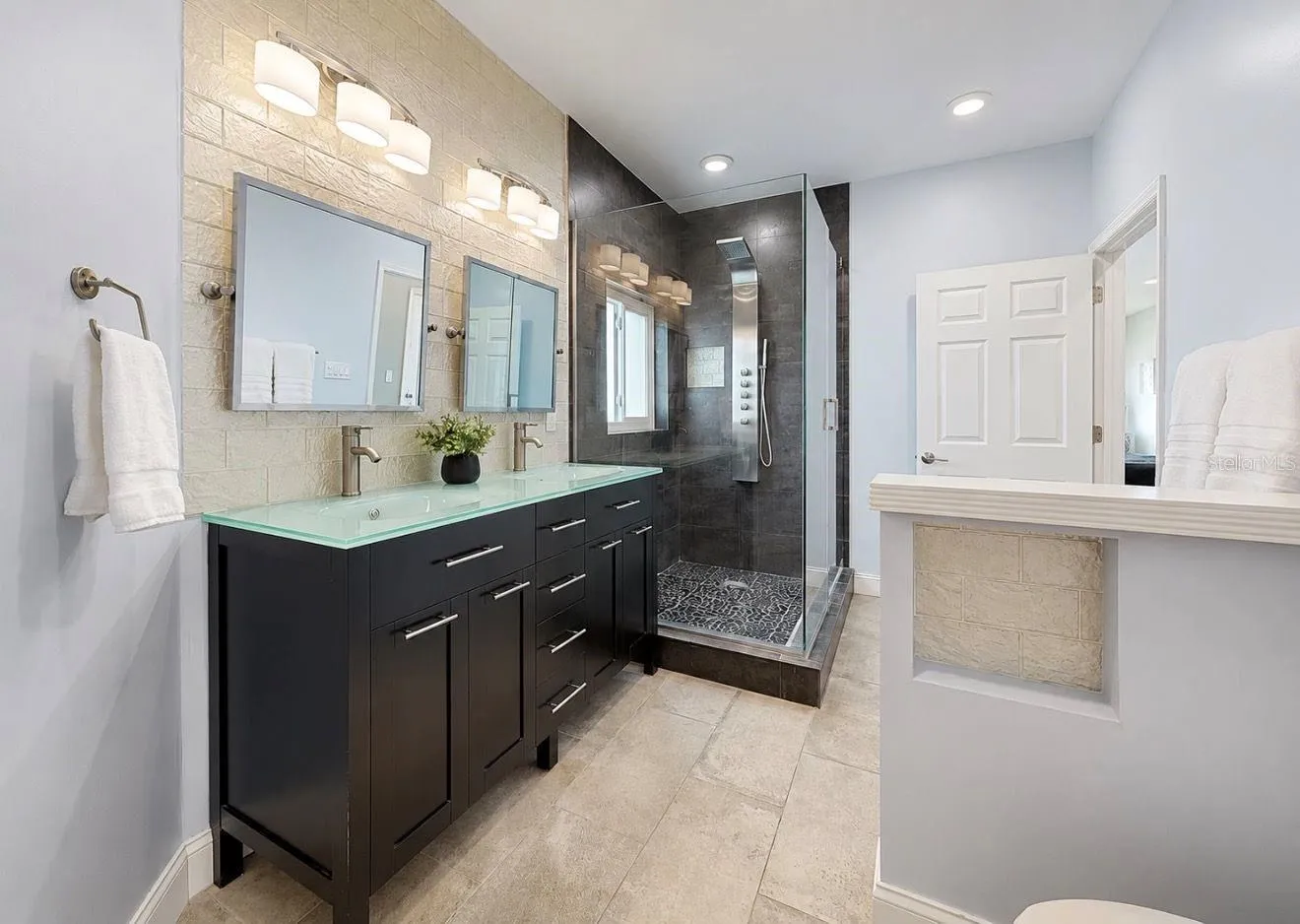 Primary bathroom shower with body jets
