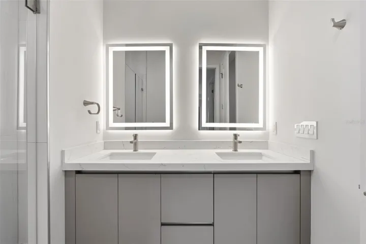 Primary Bathroom with Dual Vanity, LED Mirrors and Walk-In Glass Shower