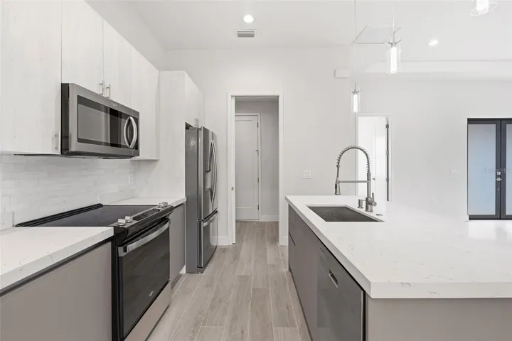 Modern Chefs Kitchen with Quartz Counters and Stainless Steel Appliances