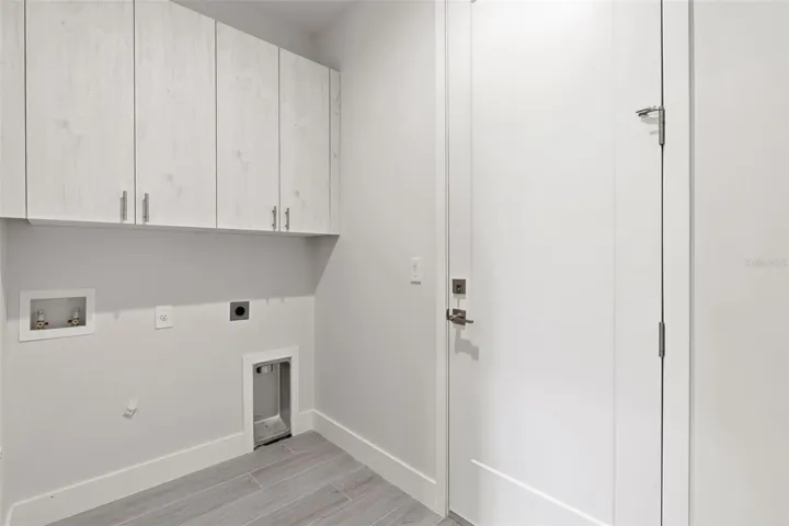 Inside Laundry Room with Extra Cabinetry