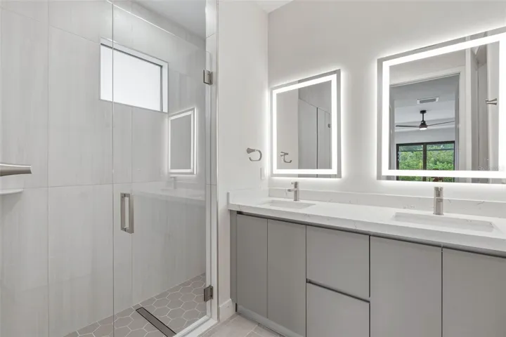 Primary Bathroom with Dual Vanity, LED Mirrors and Walk-In Glass Shower