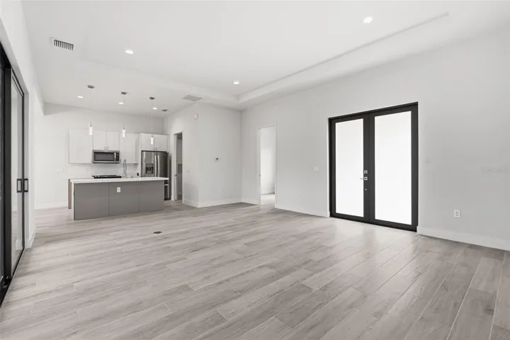 Spacious Living Area Showcasing 11ft Ceiling and Natural Light