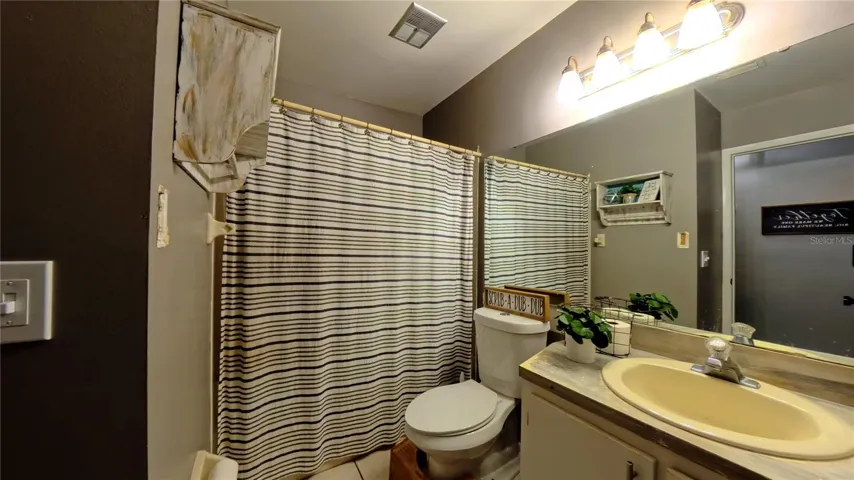 Primary bathroom vanity and tub/shower combo