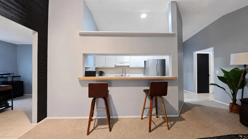 Kitchen pass-through view from living area