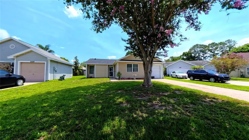 Front exterior framed by mature landscaping
