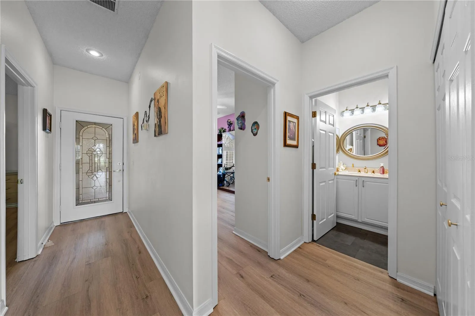 Interior view of the front entrance door and bedroom & bathroom 2.