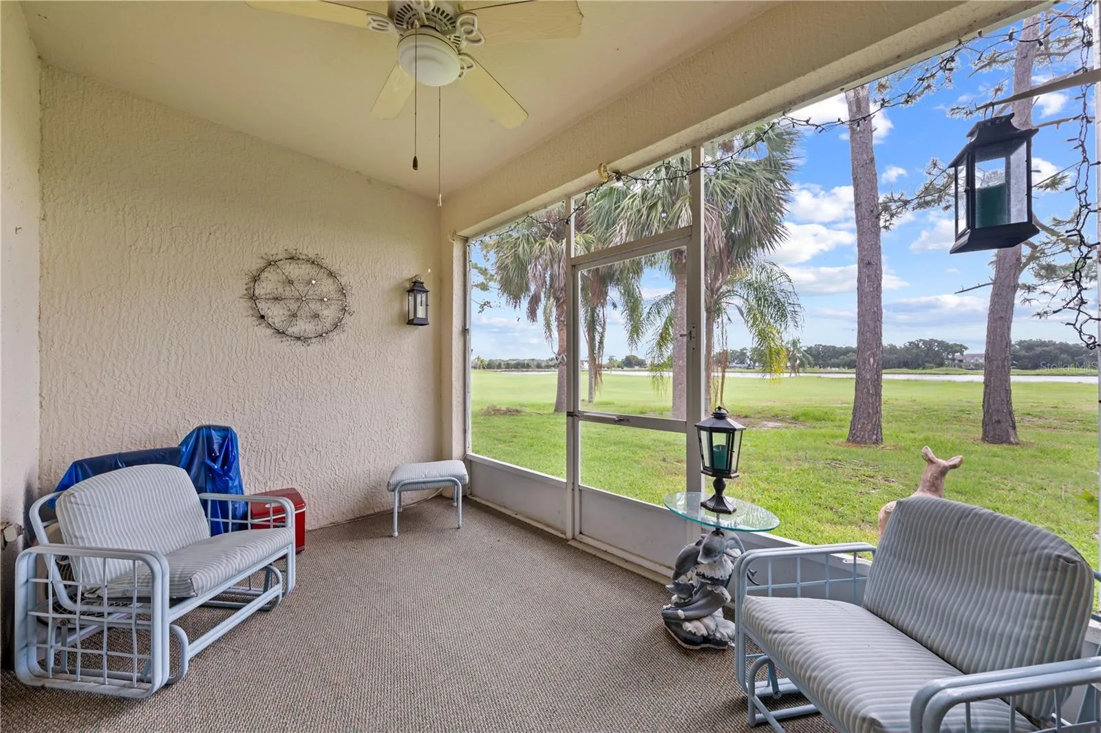 Screened and covered lanai with a few of the golf course.