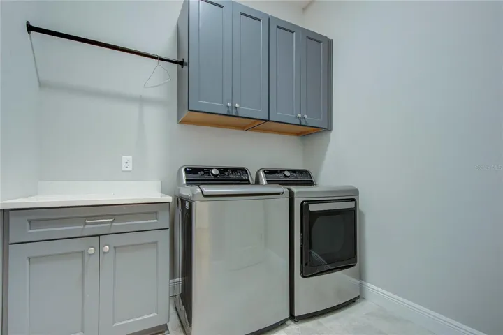 huge laundry room with closet and sink