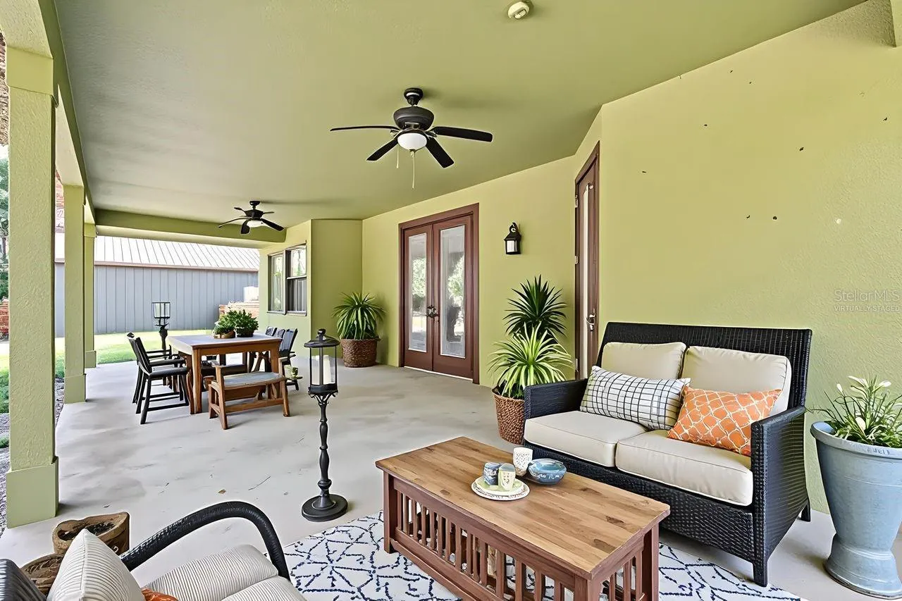 Virtually Staged Large Covered Patio with view to the Conservation Area