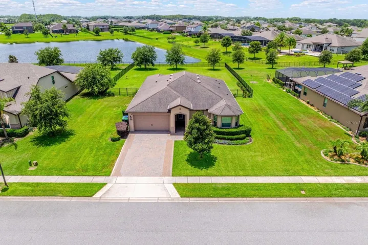Experience luxury living, PEACEFUL WATERFRONT VIEWS, and access to one of Central Florida's PREMIER SKI LAKES in this exceptional 3-bedroom, 2.5-bath estate home in the GATED COMMUNITY of Estates at Lake Pickett.