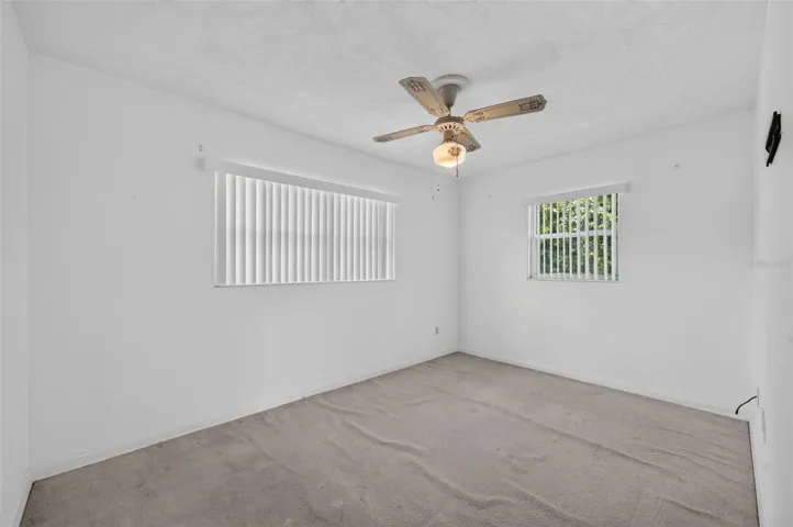 Bedroom — flooring in need of repair.