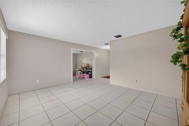 Living room, tile flooring throughout.