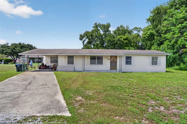 Front exterior, daytime — a sound, income-capable structure on the parcel.