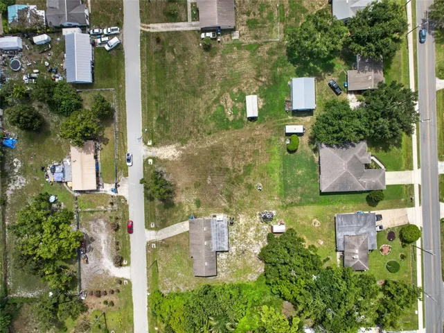 Overhead view showing the home, shed, and surrounding yard.