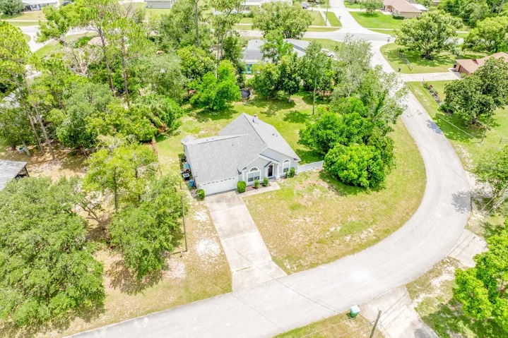 Perfectly positioned on a corner surrounded by mature trees for added privacy.