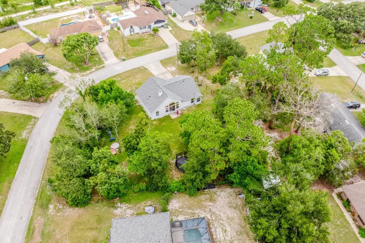 The premium lot is surrounded by mature trees.