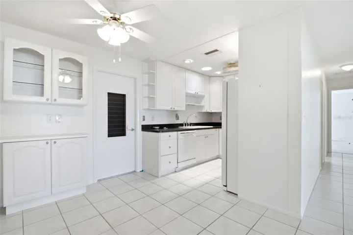 Additional built in cabinetry and convenient attached garage access~