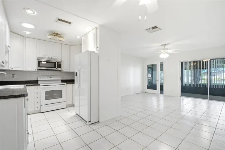 Beautifully updated kitchen with tall cabinetry up to the raised ceiling~