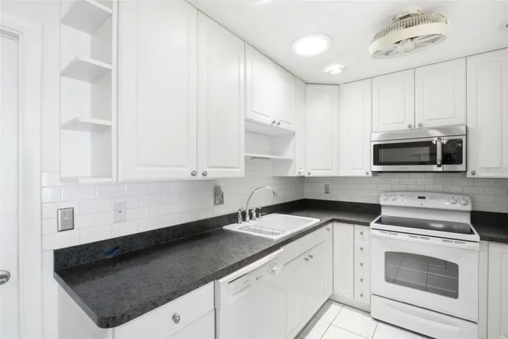Updated deep sink and beautiful subway tile backsplash~