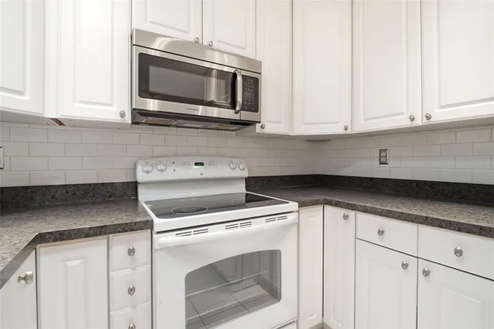 Abundant cabinets and counter space~