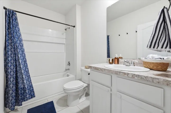 Second bathroom featuring a convenient shower/tub combination, ideally situated between the two bedrooms for optimal privacy and accessibility.