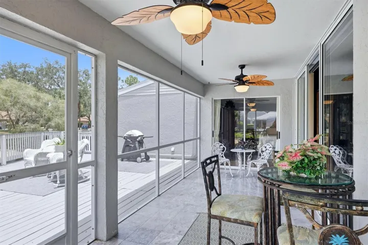 Sreened lanai with access from living rom,dinning room and primary bedroom extending out to oversized deck on the water