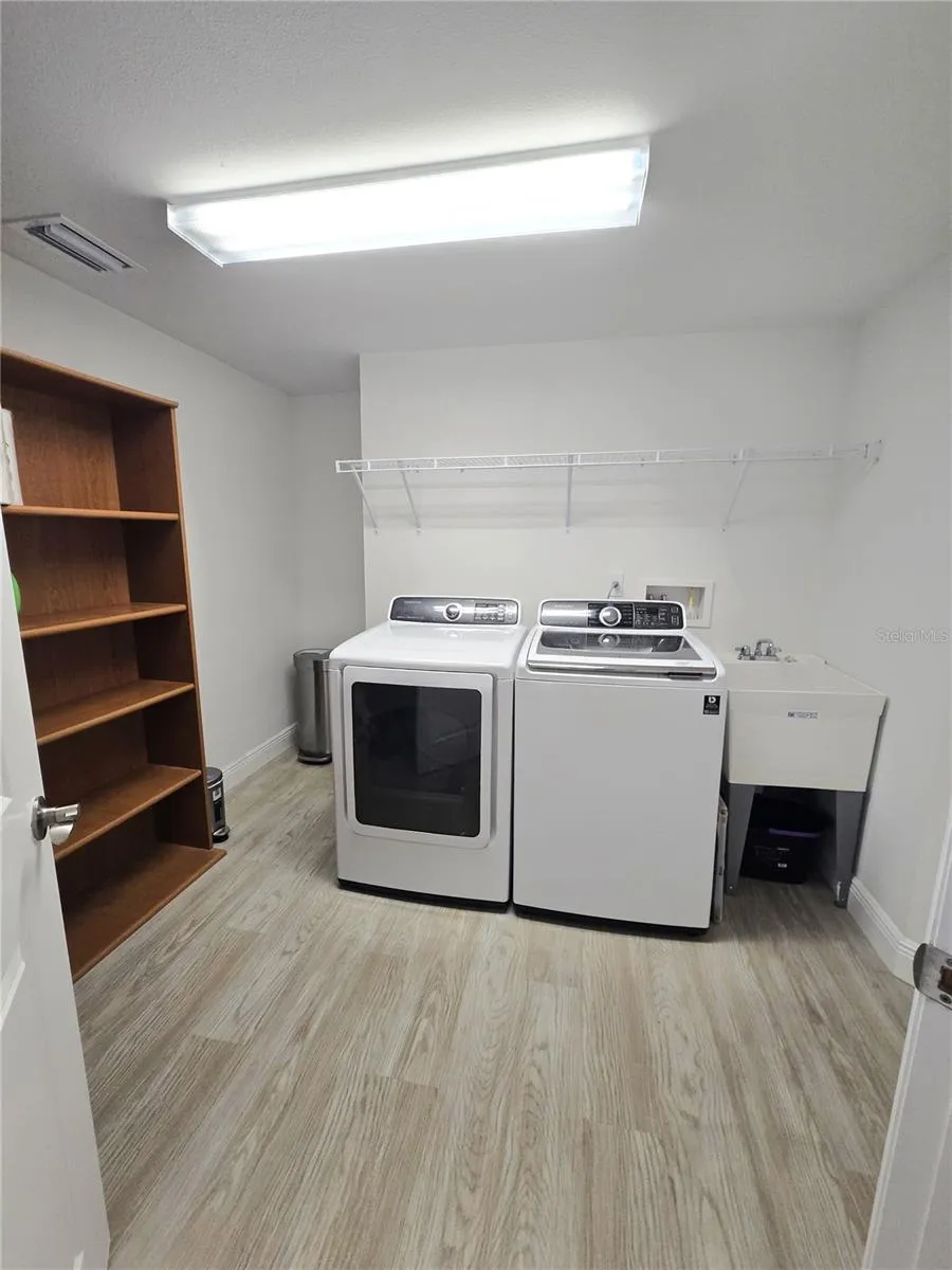 Full size laundry room with lots of storage space.