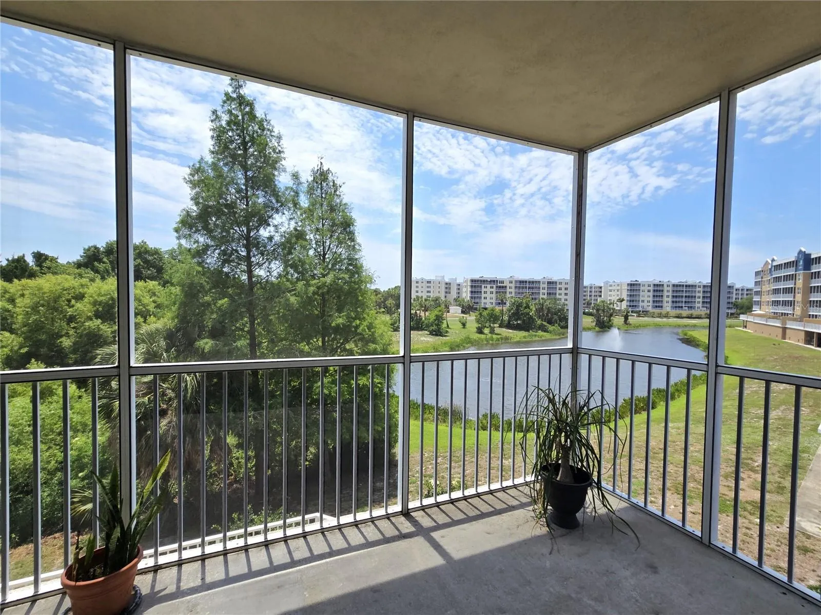 Golf, lake & conservation views from screened balcony.