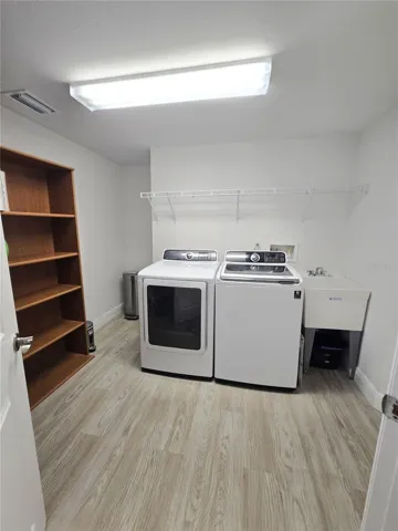 Full size laundry room with lots of storage space.