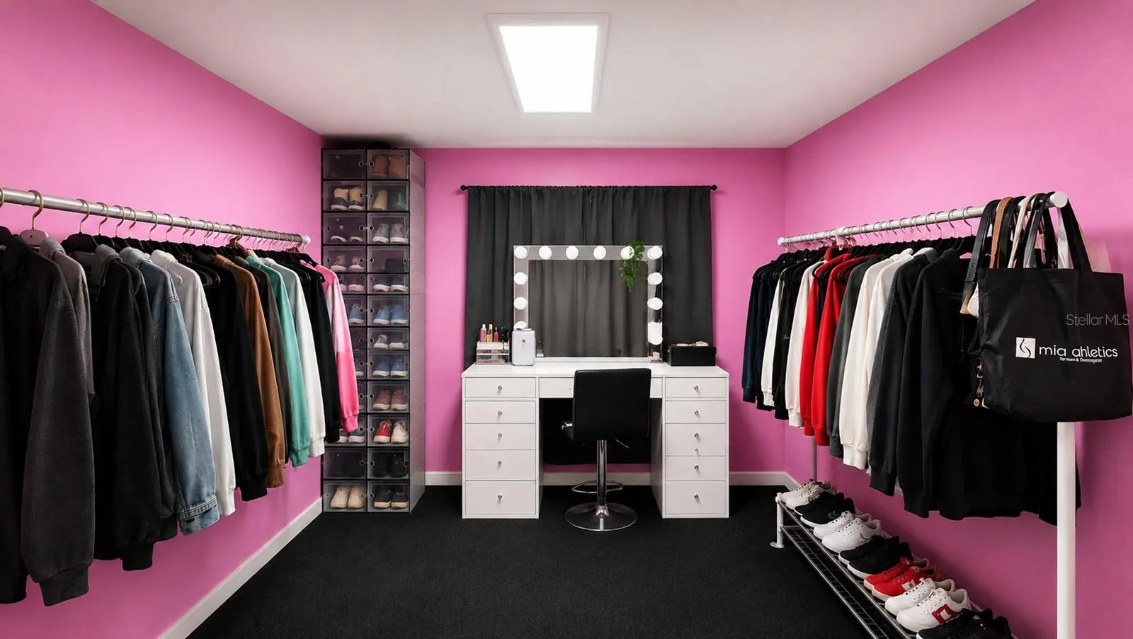 Walk in closet in primary bedroom