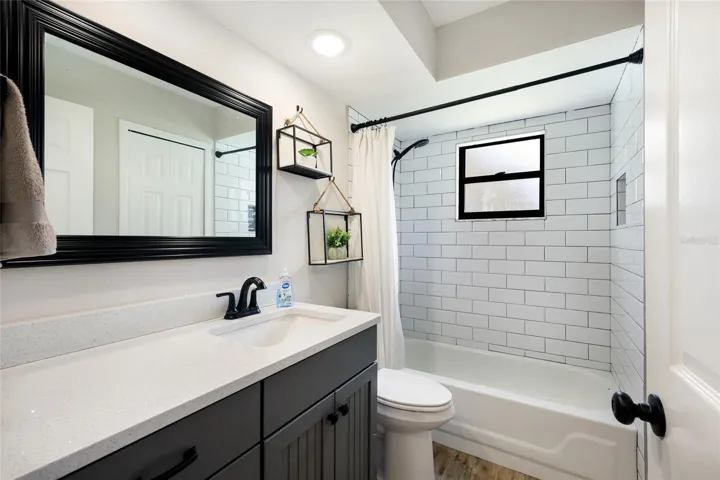 Guest bathroom with same vanity and quartz countertop