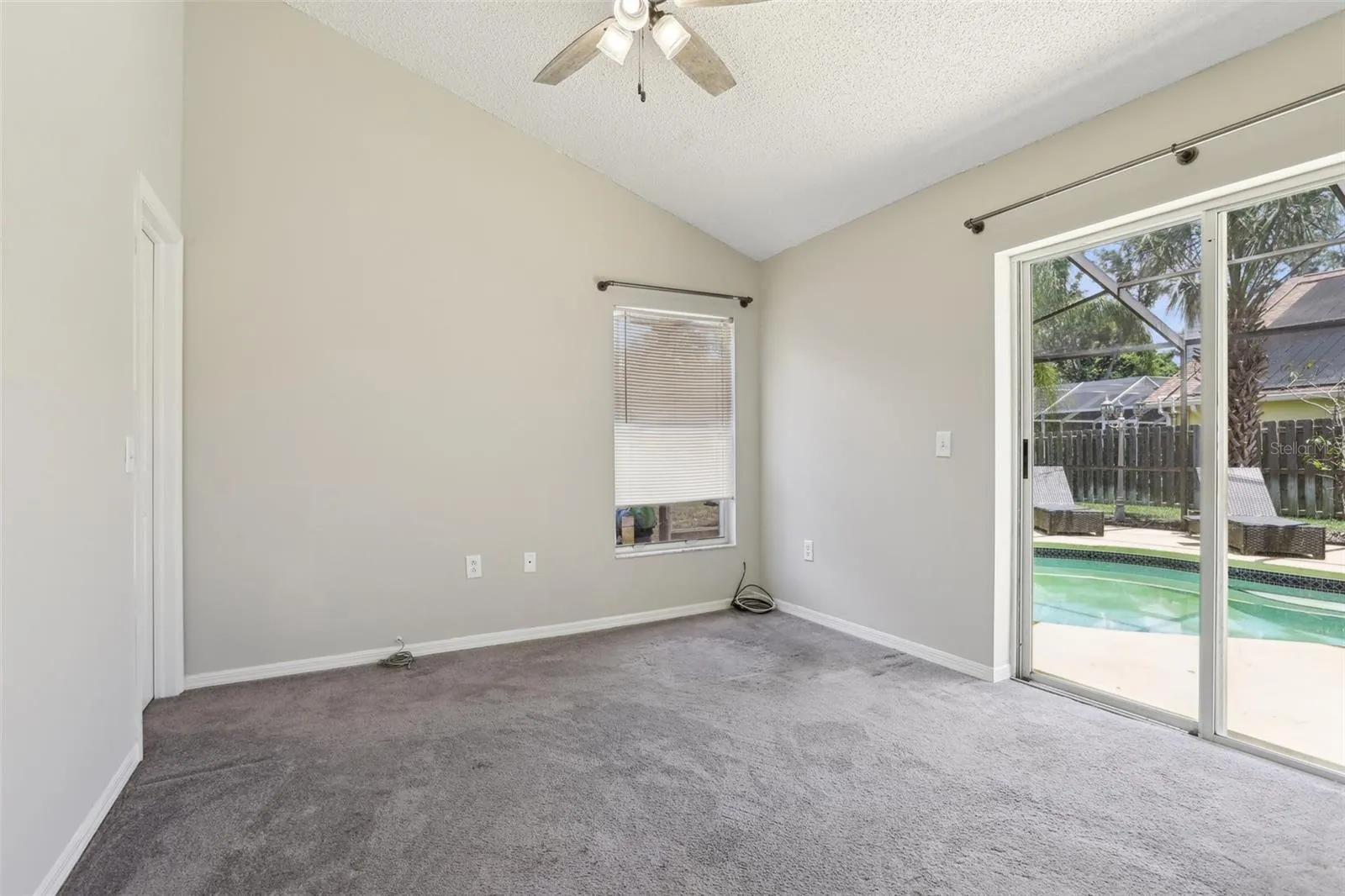 Bedroom 4 has access to the pool, conservation view and walk in closet.