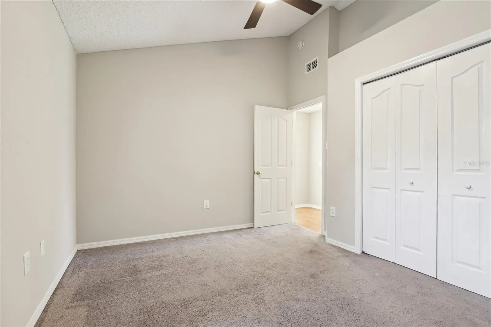 Bedroom 2 has vaulted ceilings and  reach-in closet with bi-fold doors.