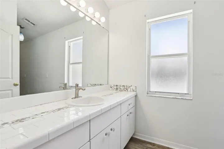 Guest bath with direct pool access.