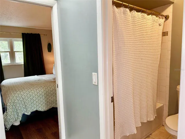 Both bedrooms connected by a Jack-n-Jill bath. With a tub/shower and toilet area