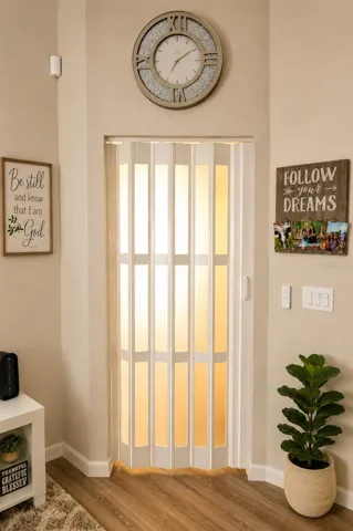 Accordion privacy door separates the living area from the hallway and BR 3 & 4
