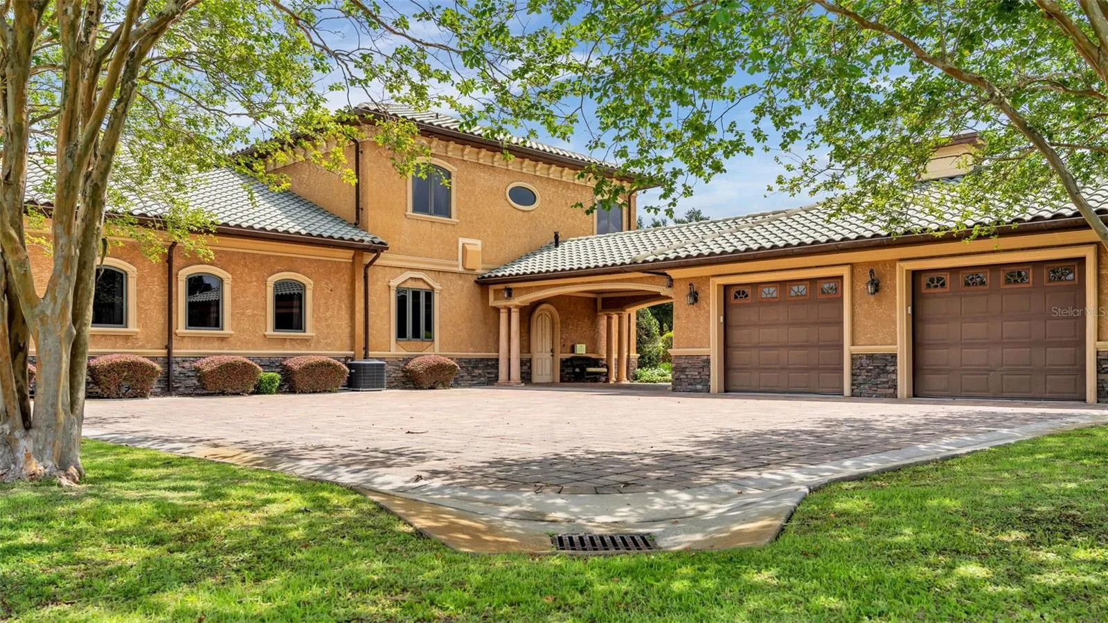 Portico and 2 car Rear Entry Garage area on the SW side of the home offers ample parking, commercial built drainage around the home.
