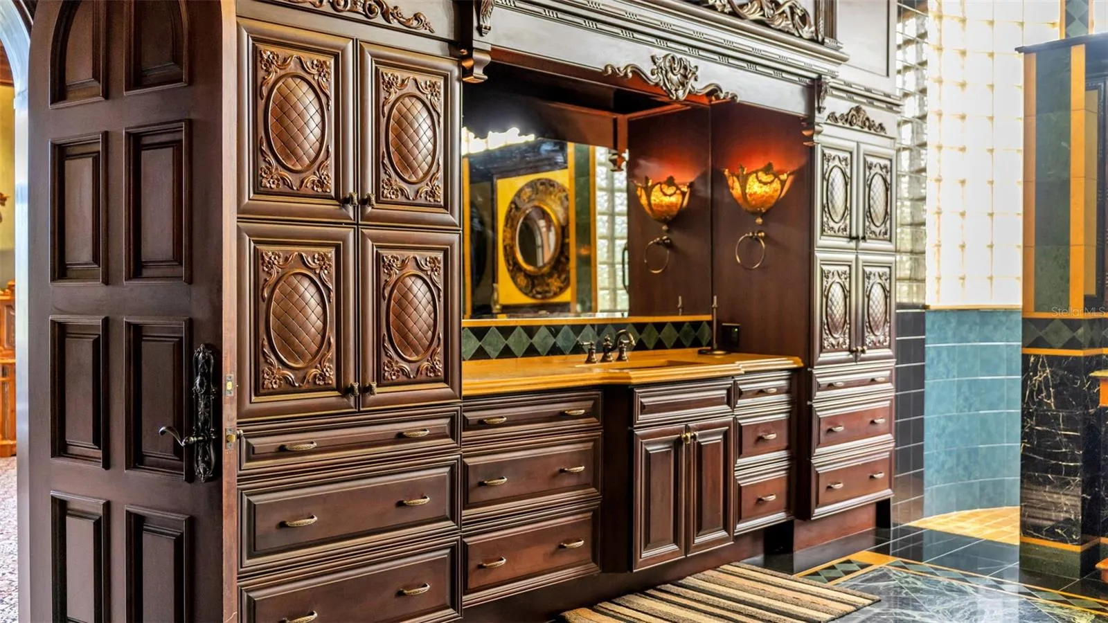 Custom Hardwood Doors & Cabinetry in Primary Bathroom, Curated custom  Lighting.