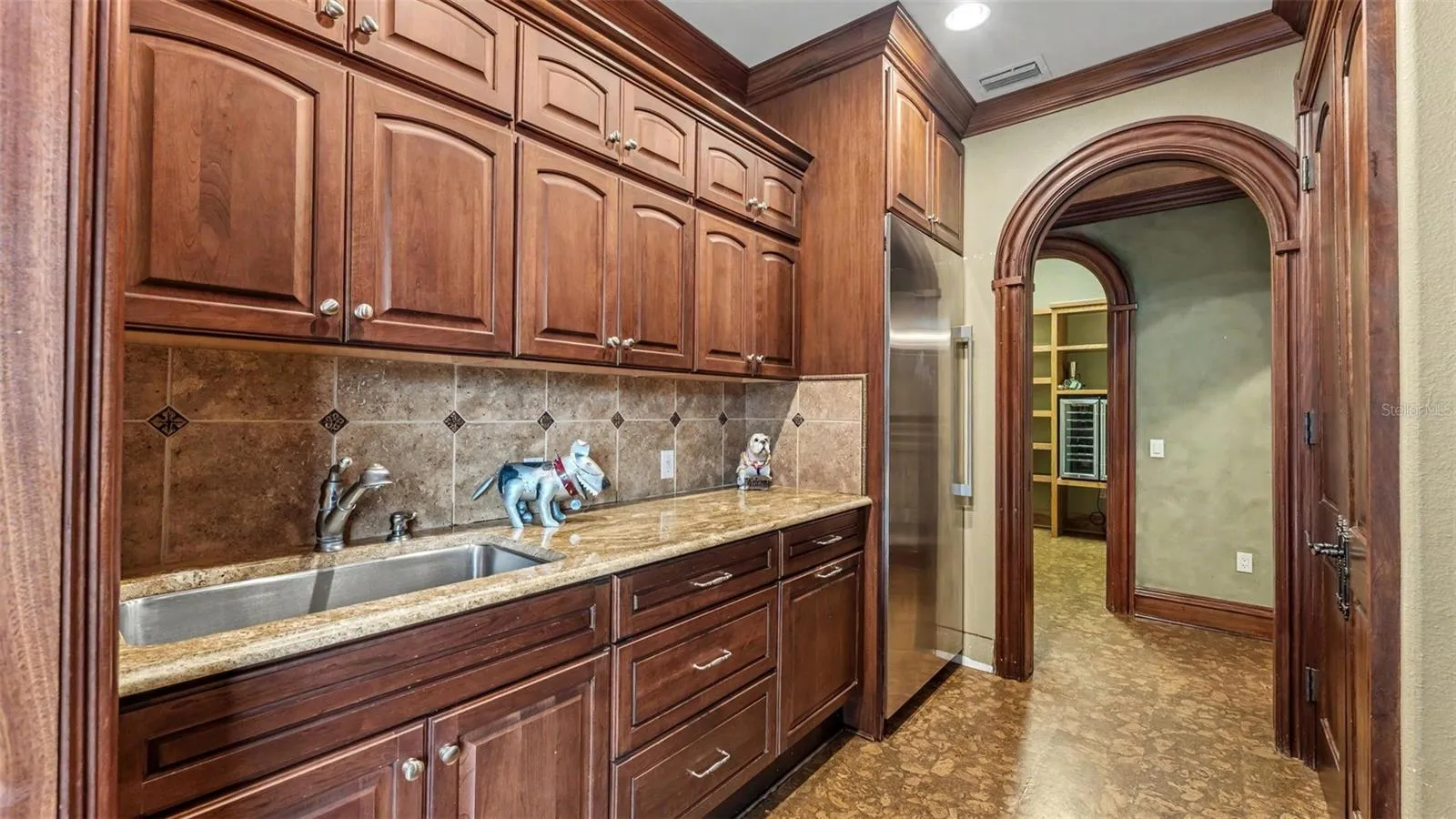 Mudd room Features exterior door to Portico, GE Monogram Subzero Freezer,  Tankless water heater, storage closet.