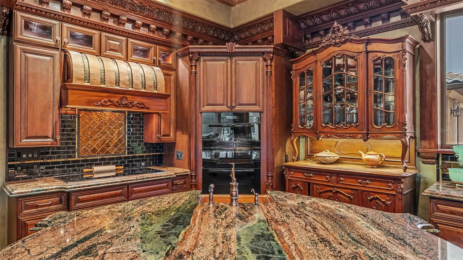 Unmatched beauty & impeccable detail line every corner of this amazing estate! Rare Exotic Granite tops this massive Island.