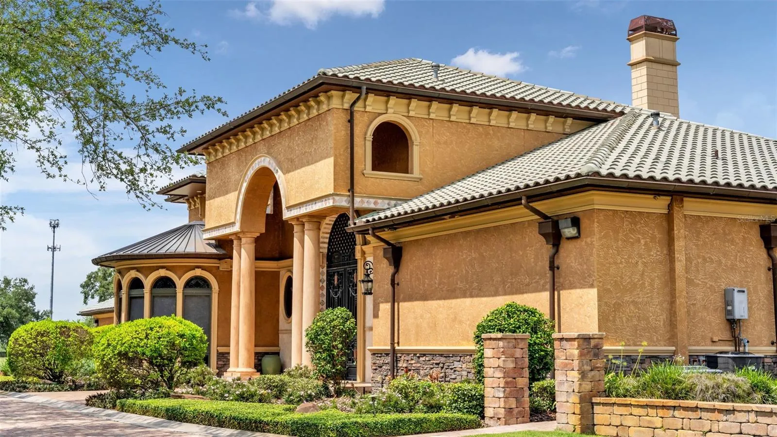 Tile Roof, accents of Stone, Solid Poured Concrete wall construction.