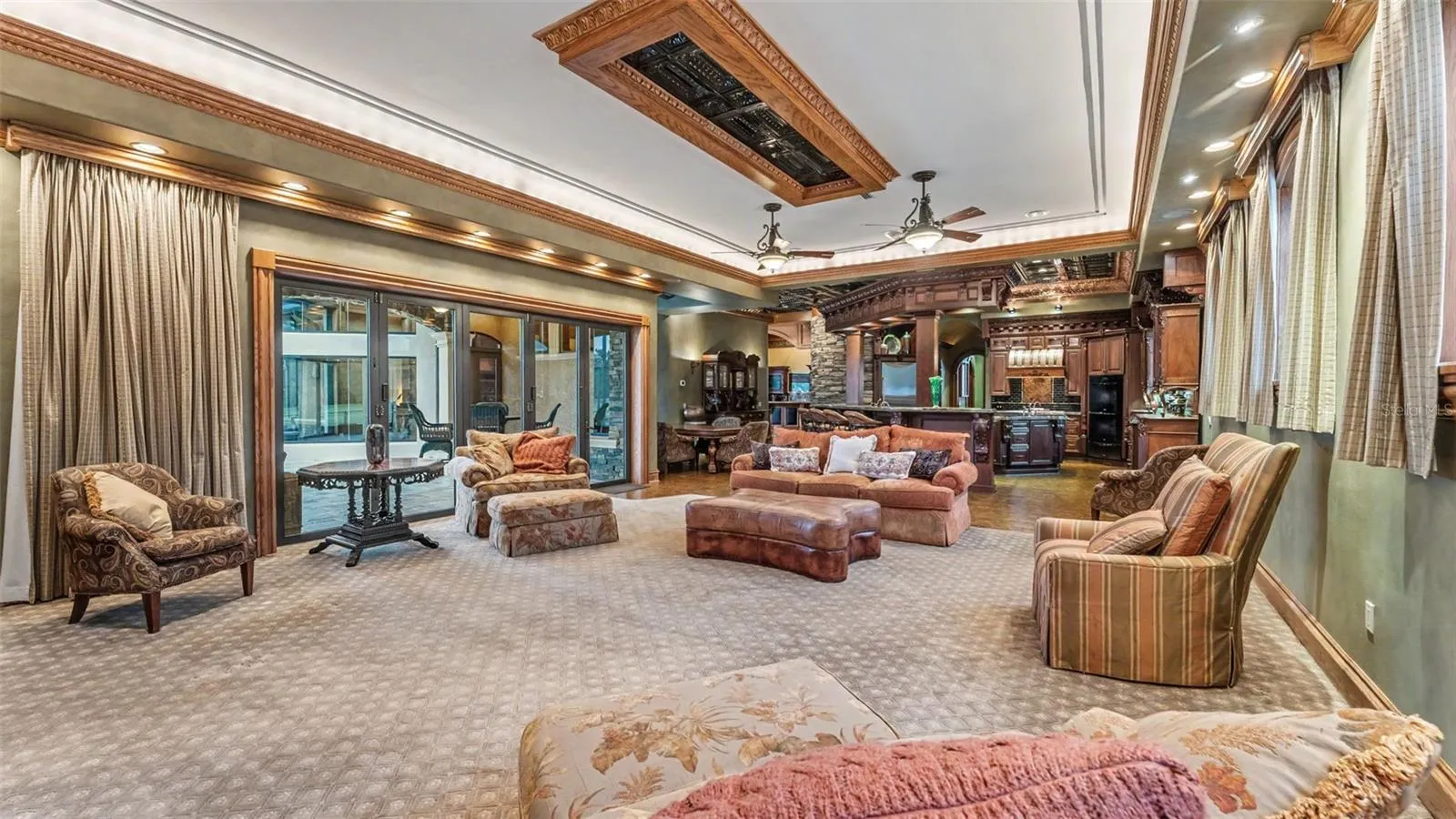 Panoramic view from every seat towards the retractable Projection screen, Projector and Lowering system are in place in the ceiling above. Seller does not warranty any electronic equipment which is being left with the home.