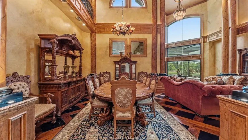 Highly Exclusive, Hand Carved , Custom-made " Treasure of the Sea" Dolphin Dining Room Suite Crafted by Arte De Mexico with the button-tufted chair backs is a definitive signature of this Ultra Luxury Collection including the corresponding bow front China Cabinet, and Massive Hand carved Hutch also Photographed as a part of the conveying personal property with the Estate.