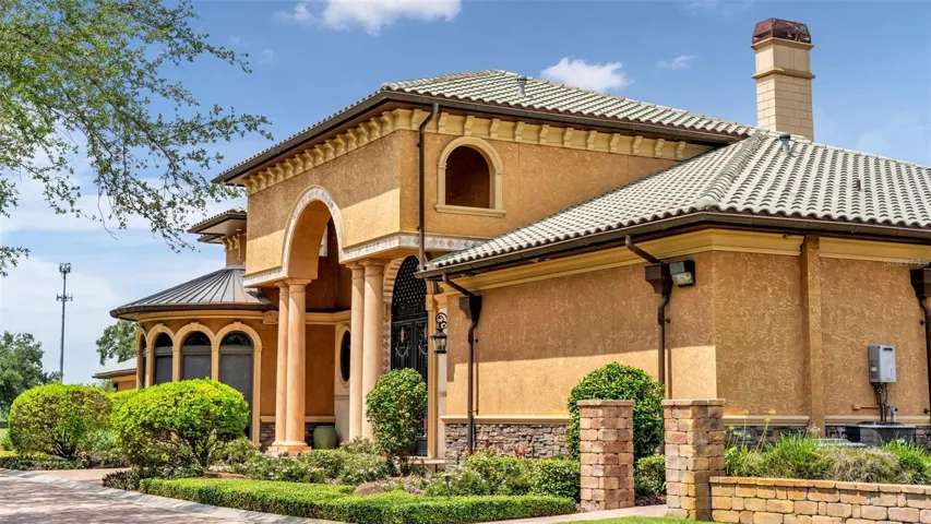 Tile Roof, accents of Stone, Solid Poured Concrete wall construction.