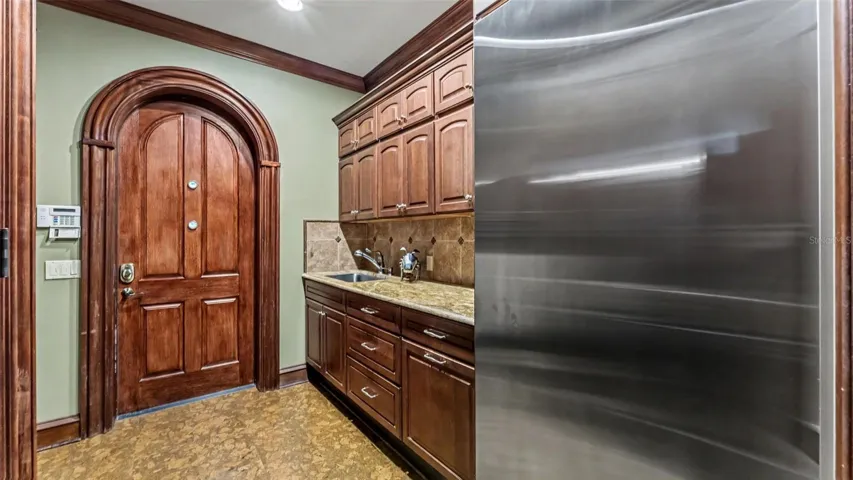 MUDD Room with storage Closet, Tankless Gas WH, Built in storage and GE Monogram Commercial FreezerSOLID ARCHED 2.5 IN Wood doors throughout the home