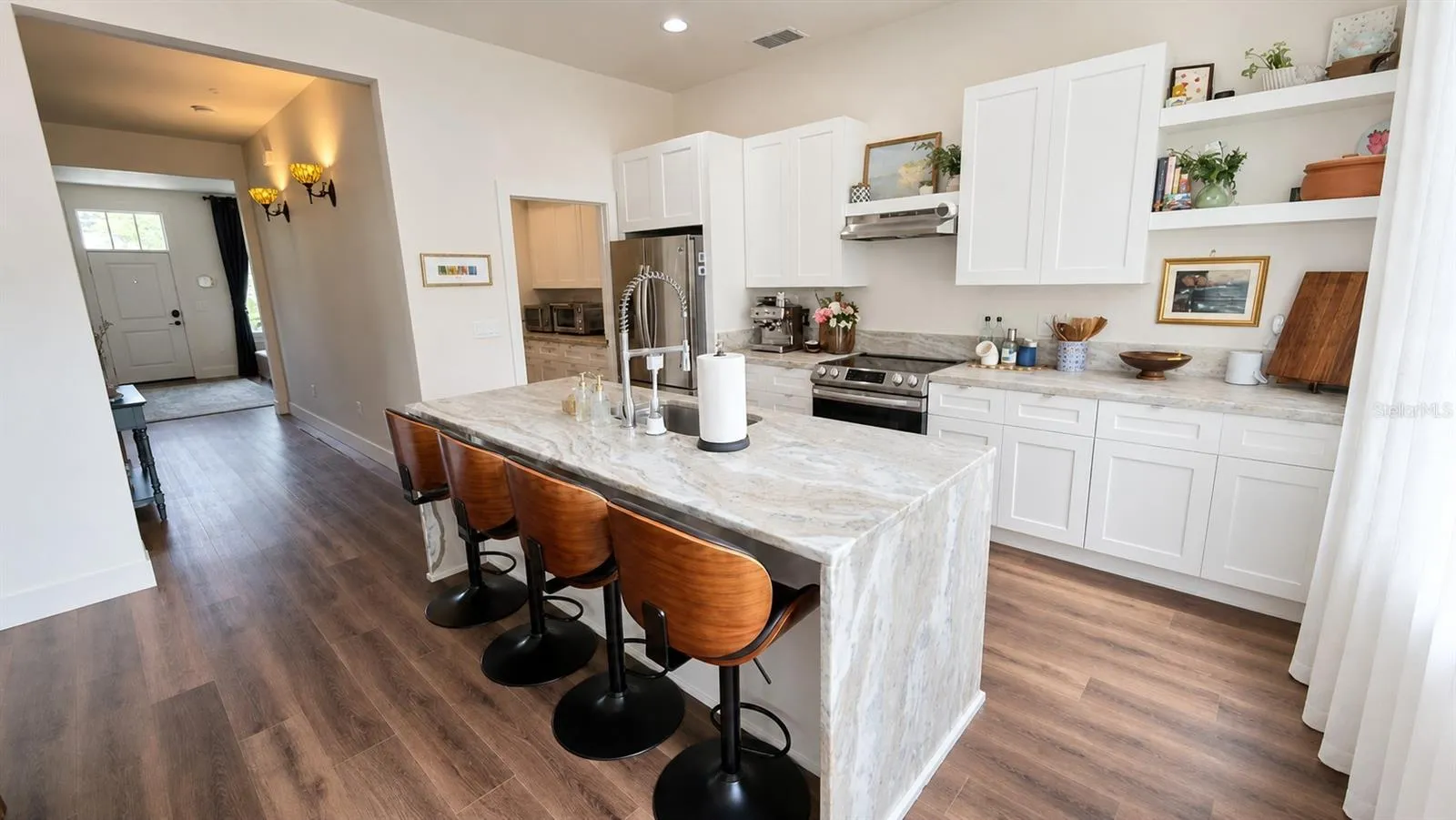 Kitchen angle to Butler, Laundry Room, Foyer to Living Room