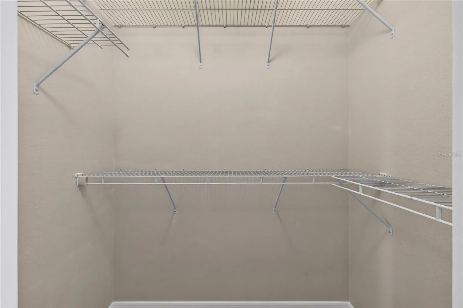 2 of 2 primary bedroom walk in closets