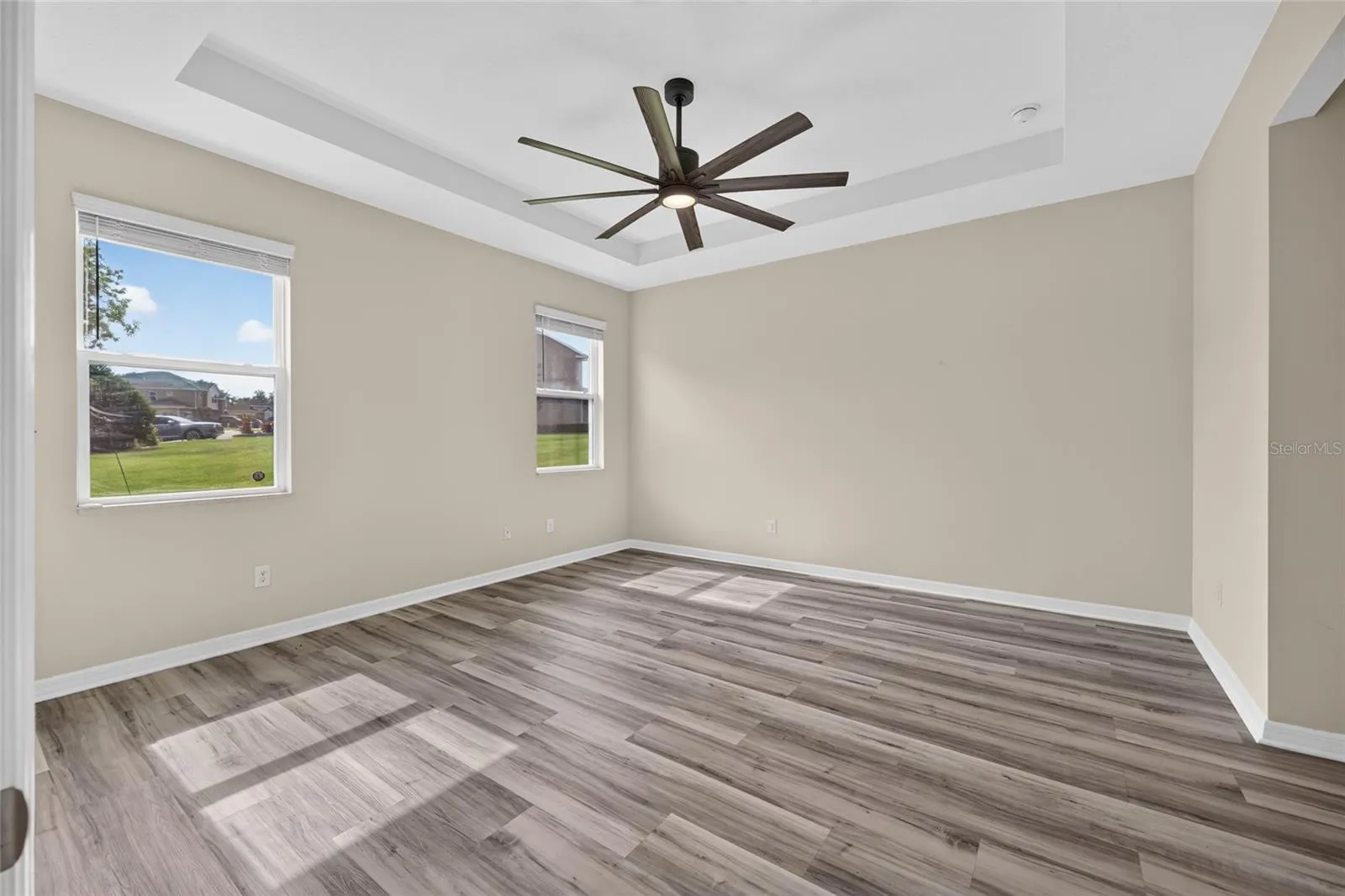 Primary bedroom with tray ceiling
