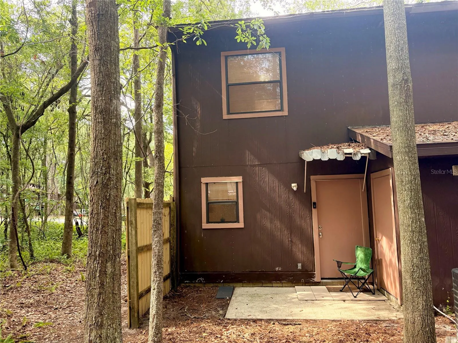 Back of home with storage closet