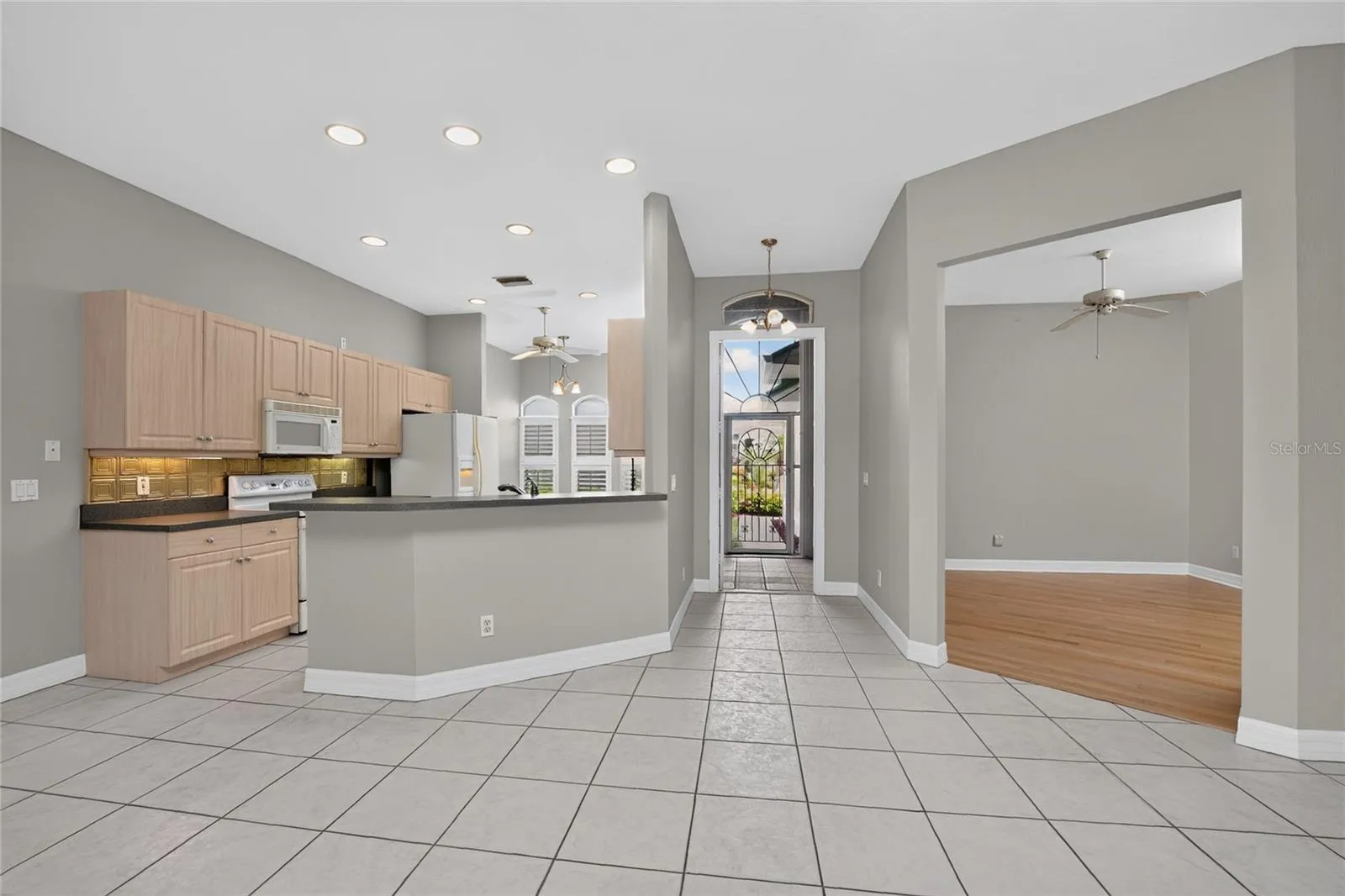 Kitchen, foyer, front entry and den.